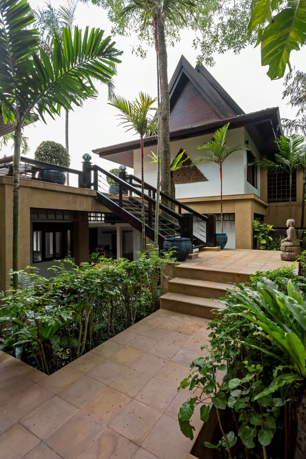 Sandstone entrance steps through the tropical garden