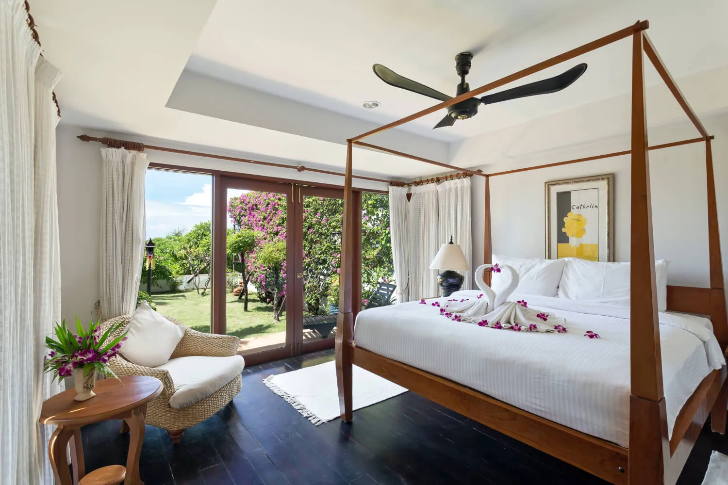 The separate guest house bedroom, four poster king bed, opening to the garden