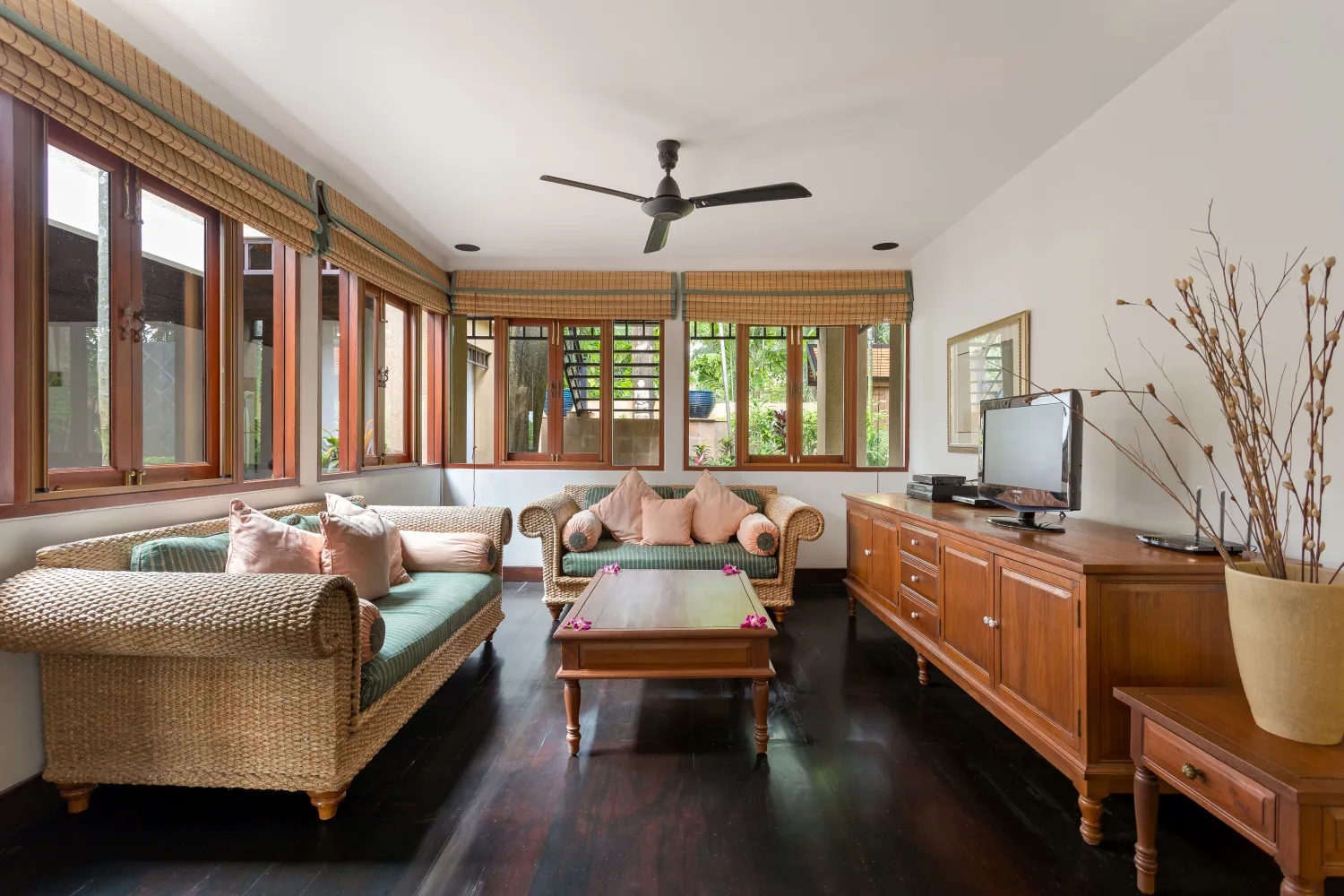 The living room with its entertainment system and garden view