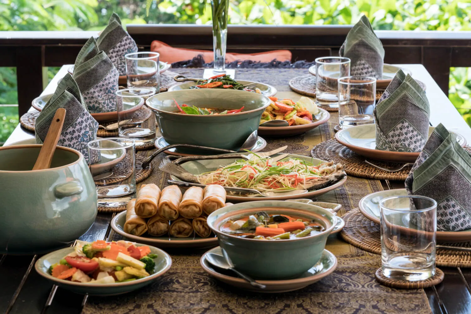 A Thai meal prepared by the villa's cook, set outdoors