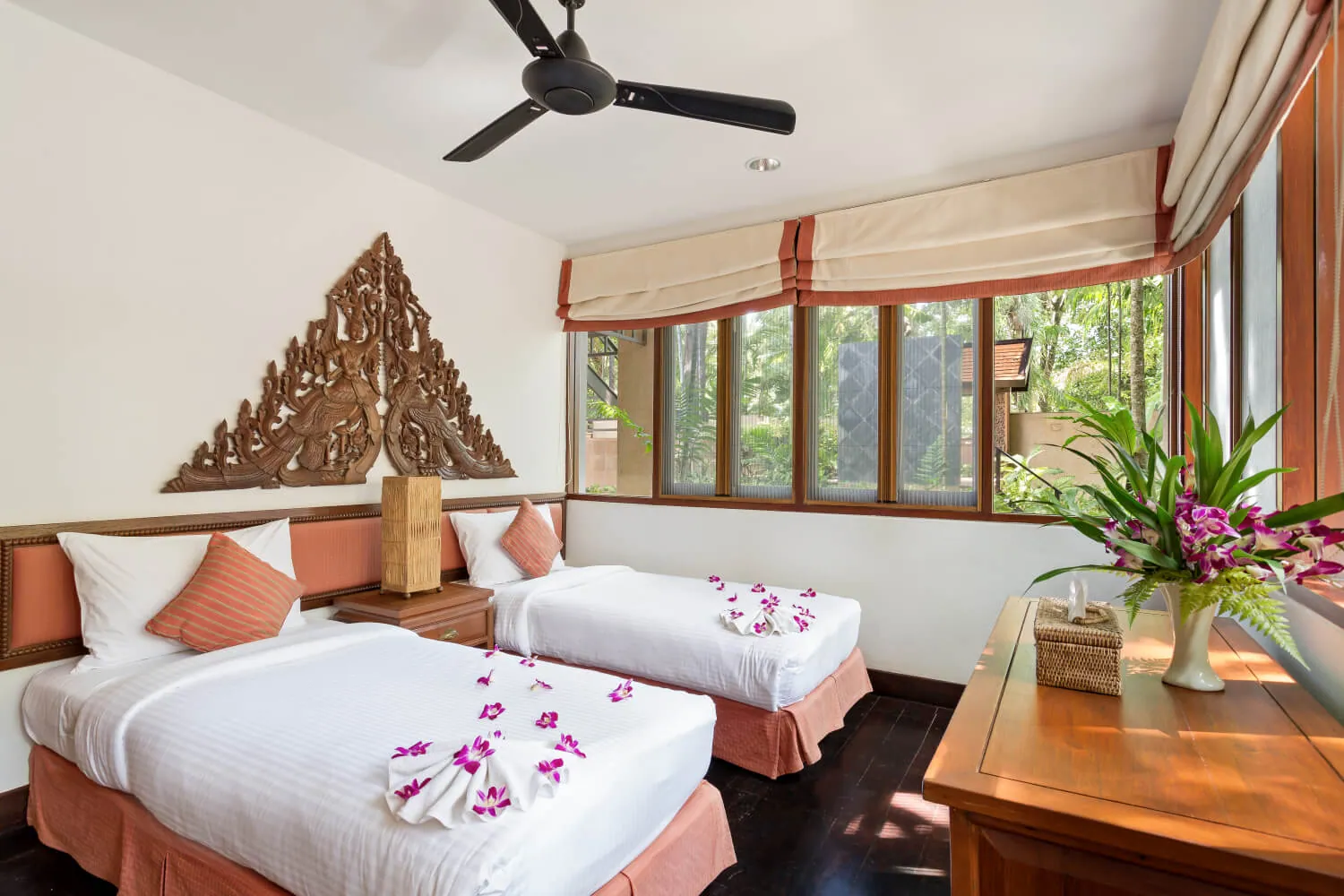 A twin bedroom with garden views